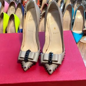 Christian Louboutin pumps.